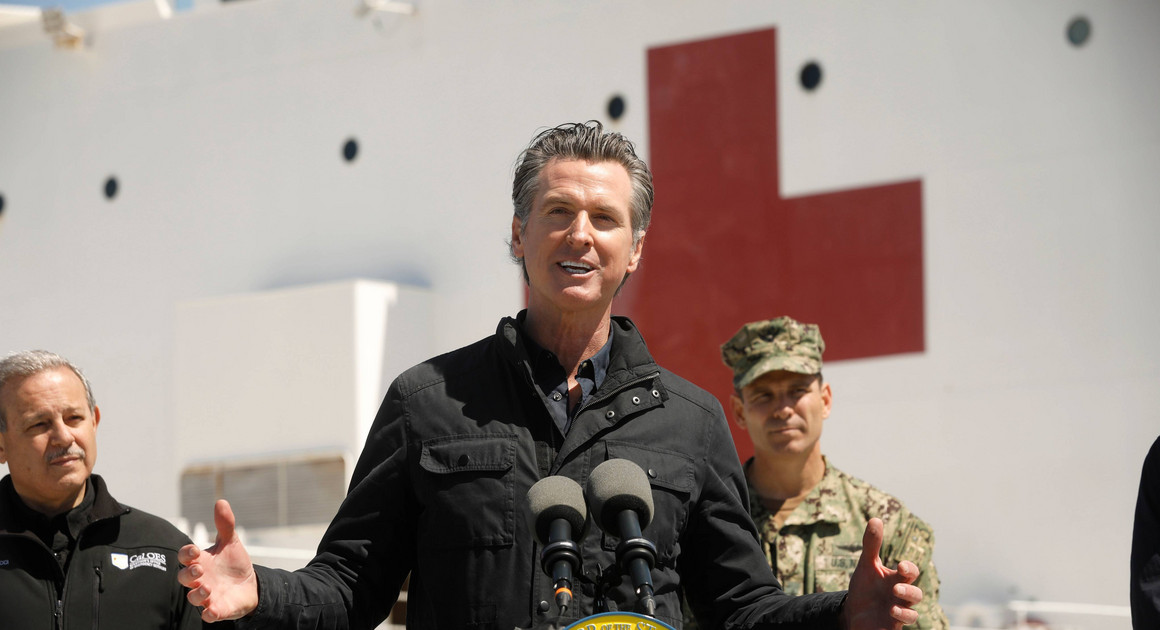 California Governor Gavin Newsom speaks in front of the hospital ship US Naval Ship Mercy. | AP Photo
