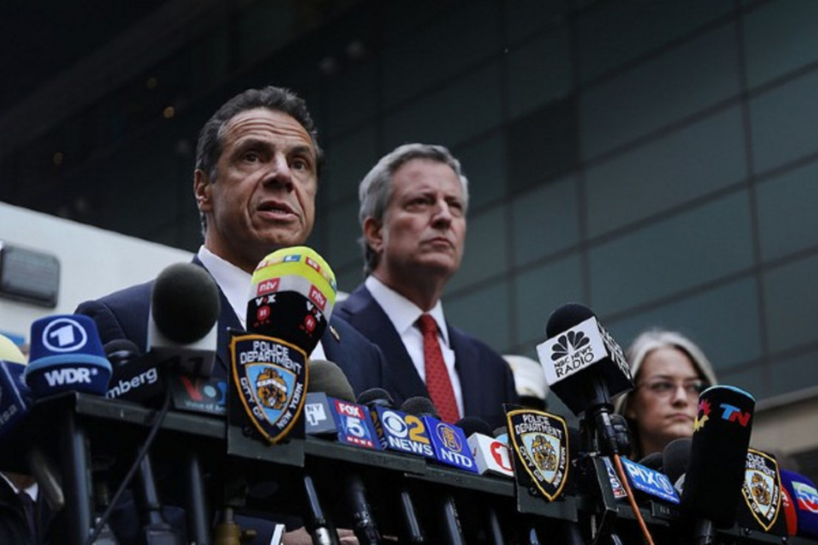Andrew Cuomo and Bill de Blasio speak at a news conference | Getty Images