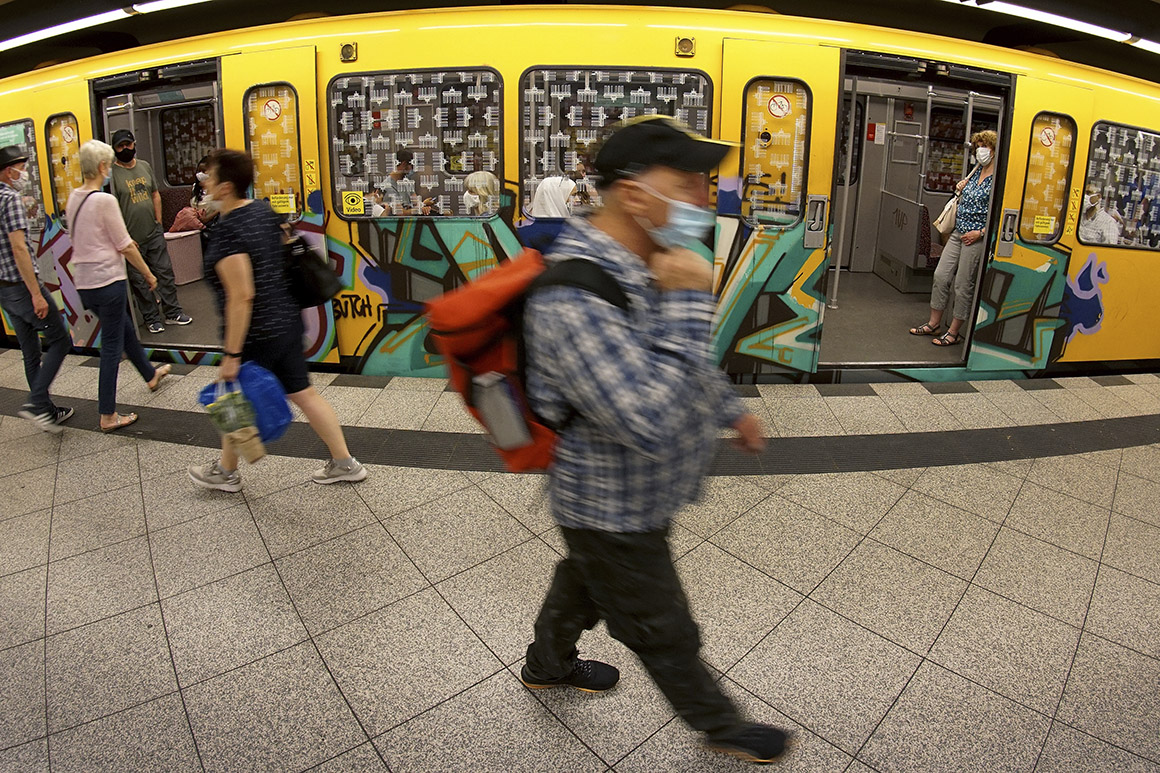 People travel Tuesday aboard the subway in Berlin.